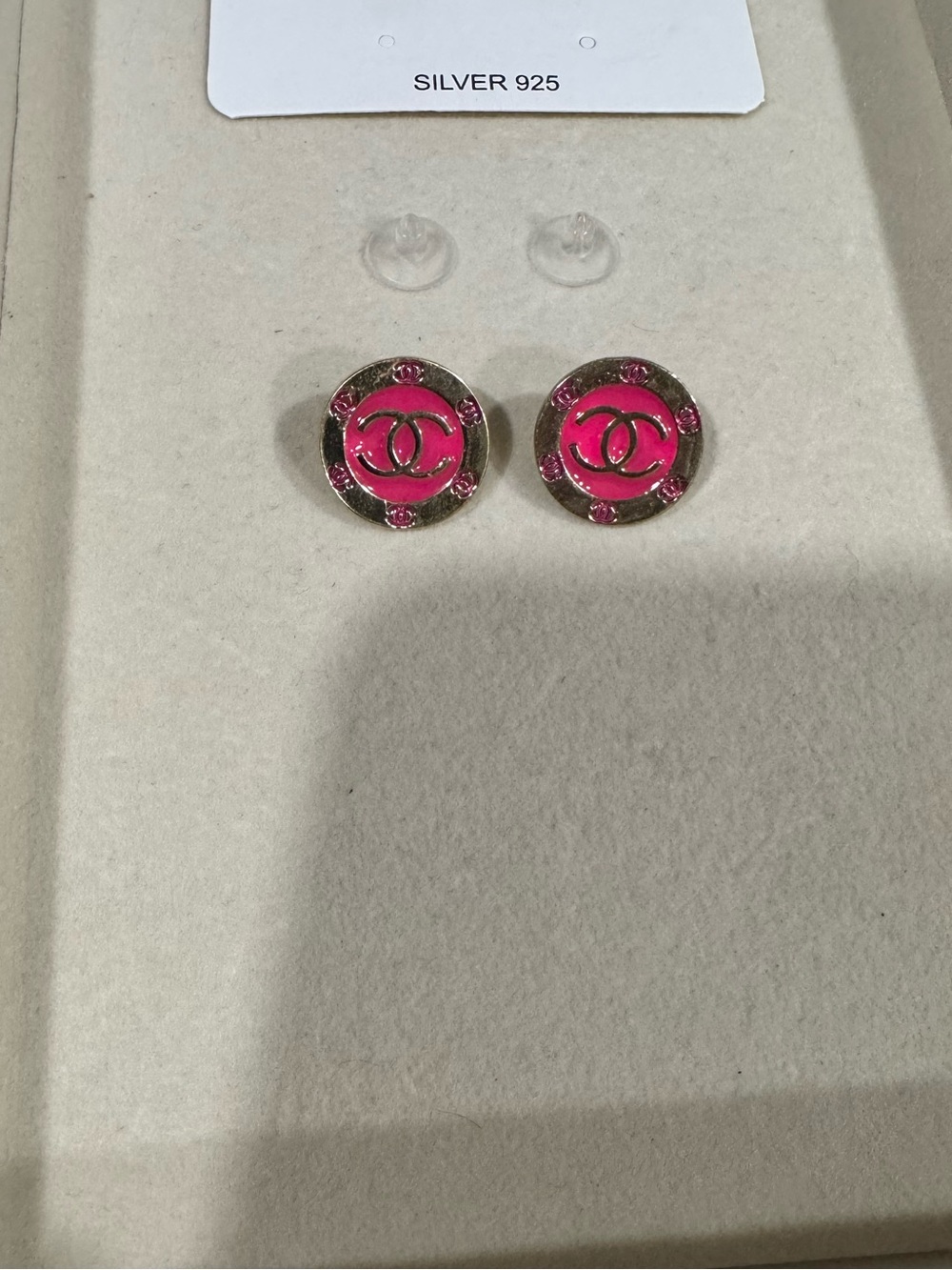 Pink and gold round studs